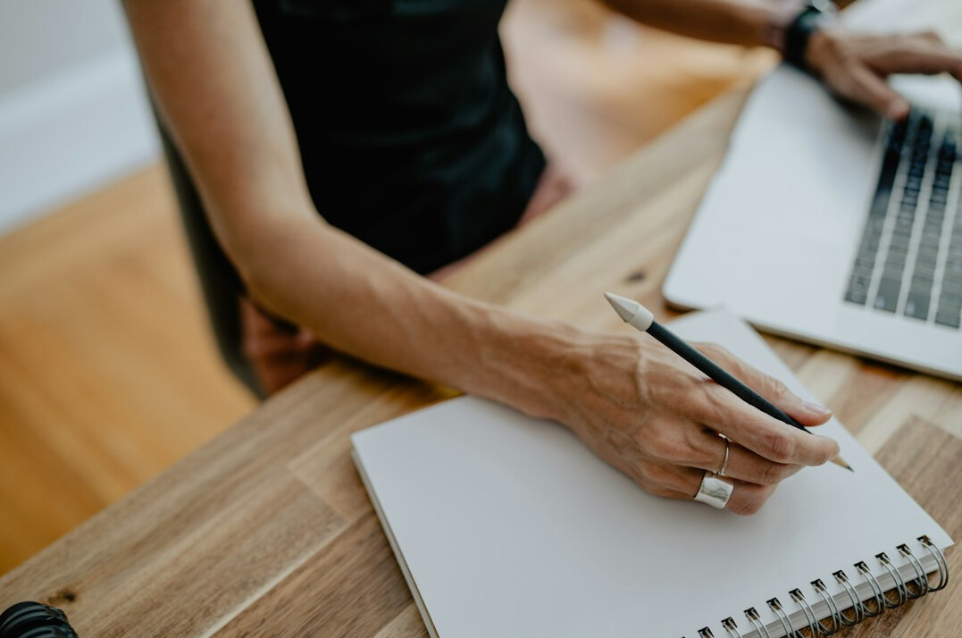 woman writing in notebook