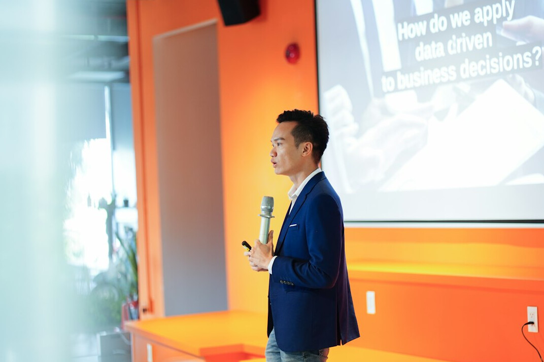person giving speech on stage