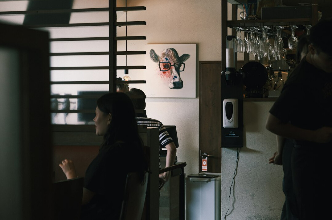 Two Brazilian friends having a warm, open conversation in a bright room